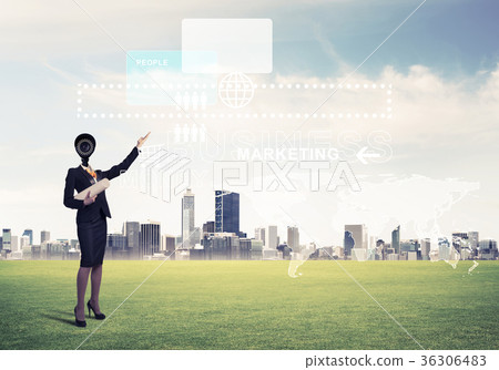 Camera headed woman standing on green grass against modern citys Camera headed woman standing on green grass against modern citys 36306483
