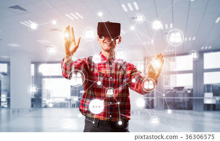 Guy wearing checked shirt and virtual mask reaching hand to touch screen Guy wearing checked shirt and virtual mask reaching hand to touch screen 36306575