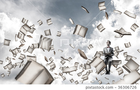 Young businessman or student studying the science and books fly Young businessman or student studying the science and books fly 36306726