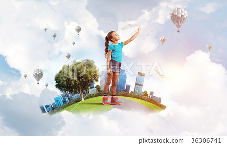 Concept of careless happy childhood with girl dreaming about future 36306741
