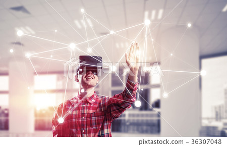 Guy wearing checked shirt and virtual mask reaching hand to touc Guy wearing checked shirt and virtual mask reaching hand to touc 36307048