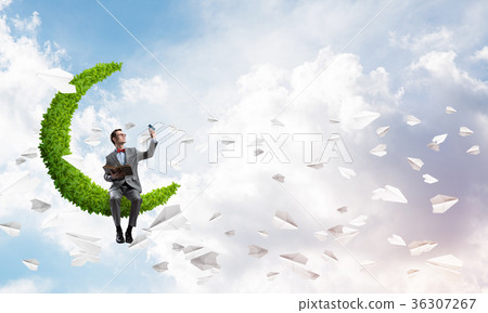 Young businessman or student studying the science and paper planes fly around 36307267