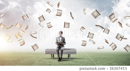 Young businessman or student studying the science and books fly Young businessman or student studying the science and books fly 36307453