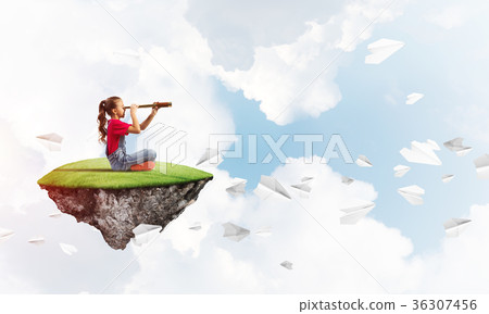 Concept of careless happy childhood with girl looking in spyglass 36307456