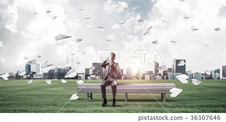Young man in summer park on bench do not want to see anything Young man in summer park on bench do not want to see anything 36307646