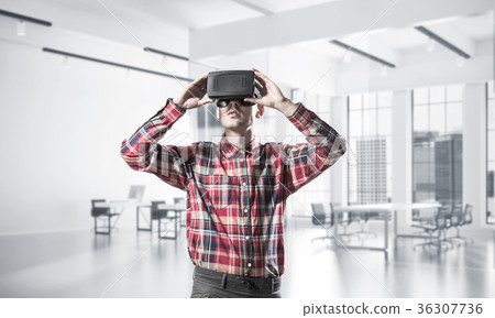 Concept of modern entertaining technologies with man wearing vir Concept of modern entertaining technologies with man wearing vir 36307736