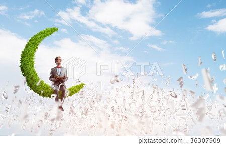 Young businessman or student studying the science and symbols fly around 36307909