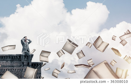 Young man sitting on top and dont want to hear anything Young man sitting on top and dont want to hear anything 36308010