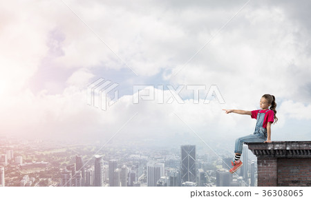 Concept of careless happy childhood with girl showing touch gesture 36308065