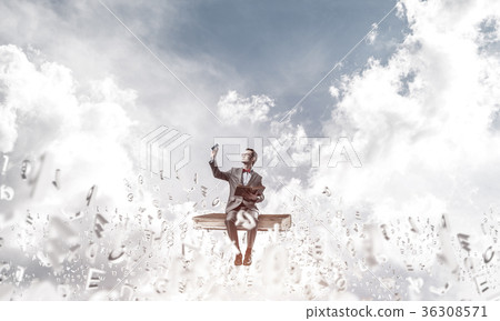 Young businessman or student studying the science and symbols fl Young businessman or student studying the science and symbols fl 36308571