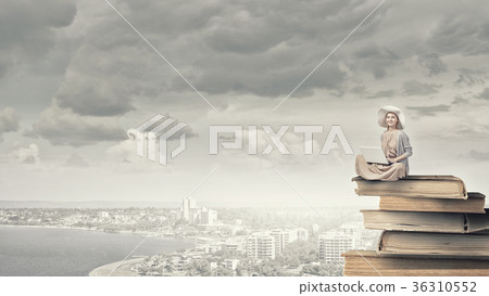 Romantic woman using laptop Romantic woman using laptop 36310552