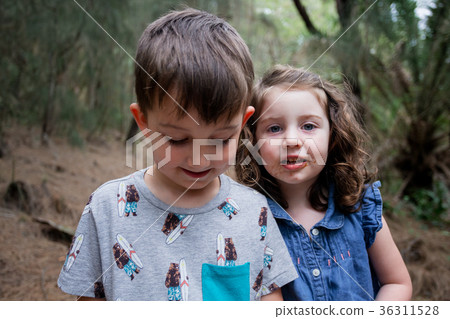 Lifestyle Portrait of Siblings Hiking 36311528