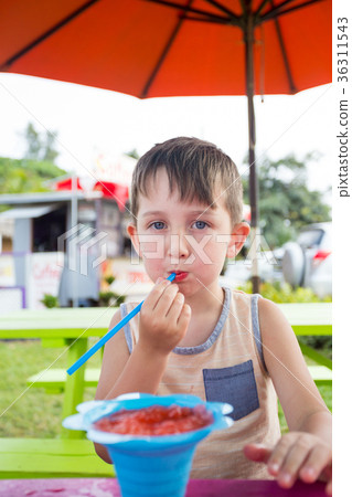Child Eating Shave Ice in Hawaii 36311543