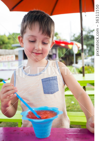 Child Eating Shave Ice in Hawaii 36311550