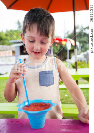 Child Eating Shave Ice in Hawaii 36311552