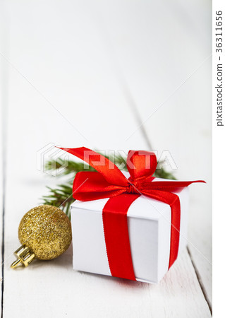 Christmas gifts spruce branch and balls. Christmas gifts spruce branch and balls. 36311656