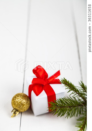 Christmas gifts spruce branch and balls. Christmas gifts spruce branch and balls. 36311658