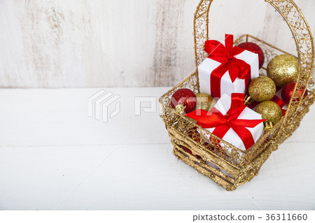 Golden basket with Christmas gifts Golden basket with Christmas gifts 36311660
