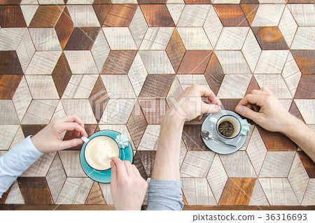 Top view of couple hands whith coffee Top view of couple hands whith coffee 36316693