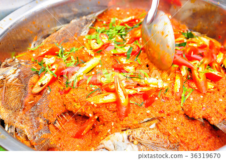 Fried fish topped with chilli sauce. Fried fish topped with chilli sauce. 36319670