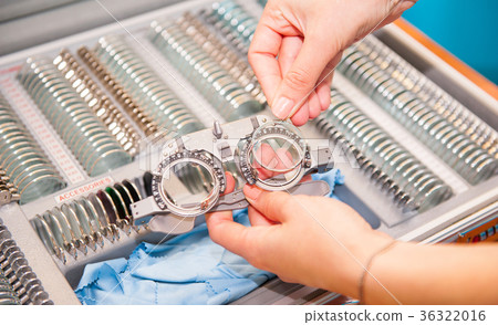 Optician female hands choose lenses Optician female hands choose lenses 36322016