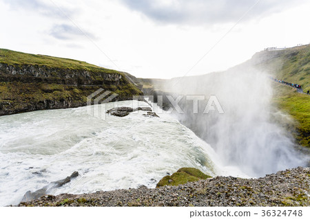 stream of waterfall and water spray over canyon 36324748