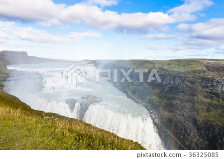 rainbow in water spray over Gullfoss waterfall rainbow in water spray over Gullfoss waterfall 36325085