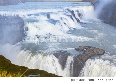 view of Gullfoss waterfall flow from canyon edge 36325267