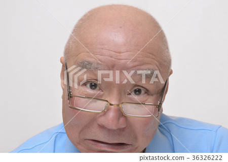 Angry senior with reading glasses 36326222