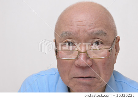 Angry senior with reading glasses 36326225