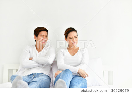 A couple lover is upset about something in the bedroom. A couple lover is upset about something in the bedroom. 36329079