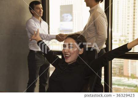 Businessmen are working diligently in the office. 36329423
