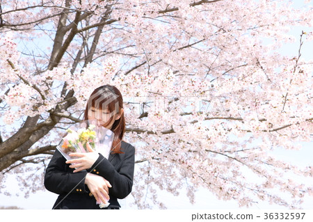 A woman with a suit with cherry blossoms and bouquets 36332597