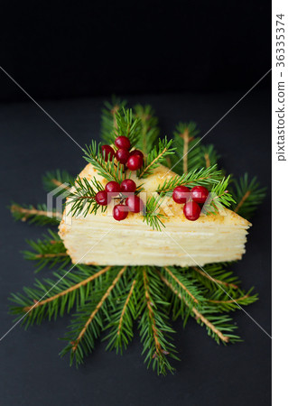 piece of cake decorated tree and berries on a piece of cake decorated tree and berries on a 36335374