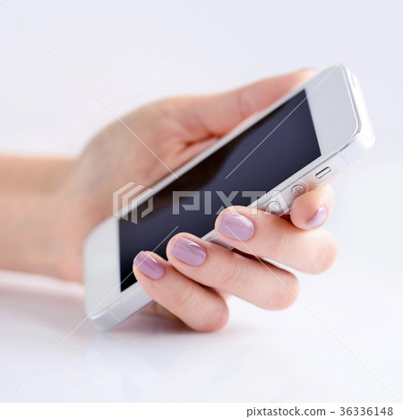 Mobile phone in female hand Mobile phone in female hand 36336148