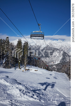 Skiers on the chairlift 36336978
