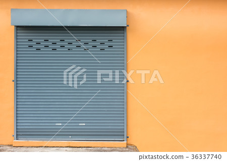 Roller Shutter Door on Yellow Wall. 36337740