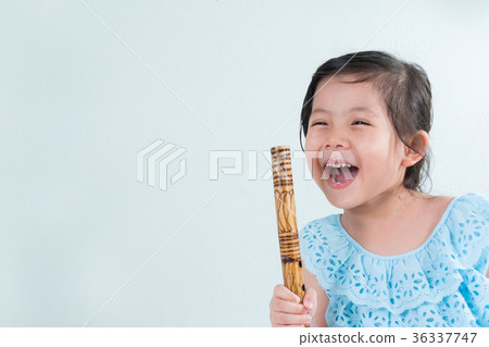Thai Little Cute Girl in Traditional Dress Playing Thai Bamboo F Thai Little Cute Girl in Traditional Dress Playing Thai Bamboo F 36337747