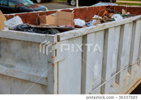 Dumpsters being full with garbage 36337885