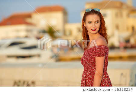 Young woman walks on the historical european streets of old town Young woman walks on the historical european streets of old town 36338234