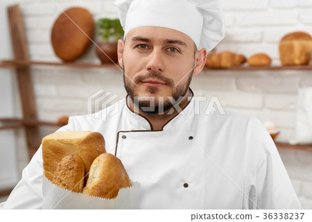 Young man working at his bakery 36338237