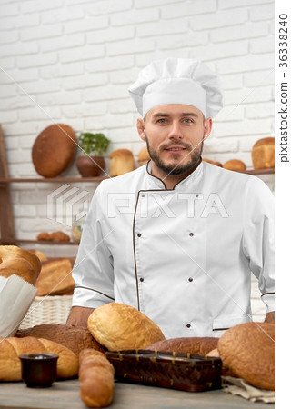 Young man working at his bakery 36338240