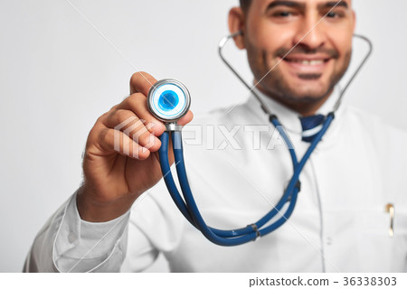 Male doctor posing at studio Male doctor posing at studio 36338303