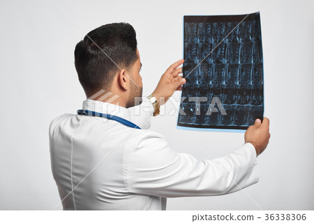 Male doctor posing at studio Male doctor posing at studio 36338306