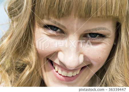 Portrait of young woman with blond hair 36339447