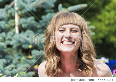 Portrait of young woman with blond hair 36339983