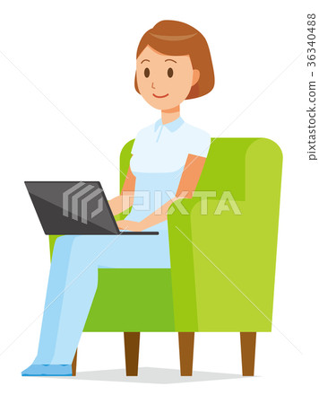 A female nurse in a white uniform is sitting on the sofa and operating a laptop 36340488