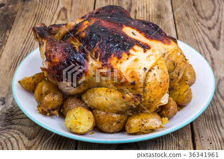Grilled chicken with burnt skin Grilled chicken with burnt skin 36341961