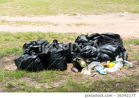 Full garbage bag on the roadside,dirty trash 36342177