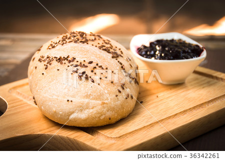 Fresh baked bread with Fruit jam on wooden Fresh baked bread with Fruit jam on wooden 36342261